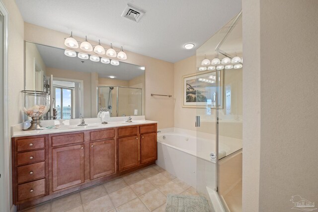 bathroom with shower with separate bathtub, dual bowl vanity, and tile patterned floors