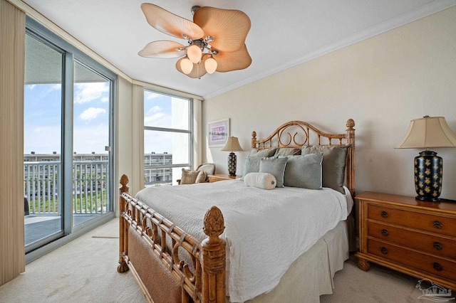 bedroom featuring multiple windows, access to exterior, and light colored carpet