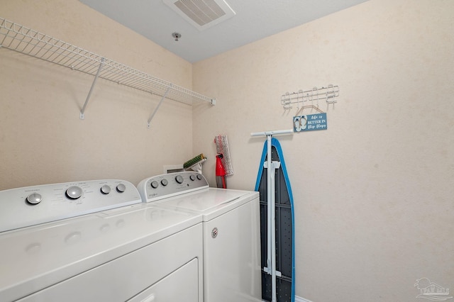 clothes washing area with independent washer and dryer