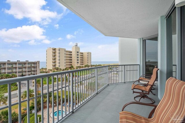 balcony featuring a water view