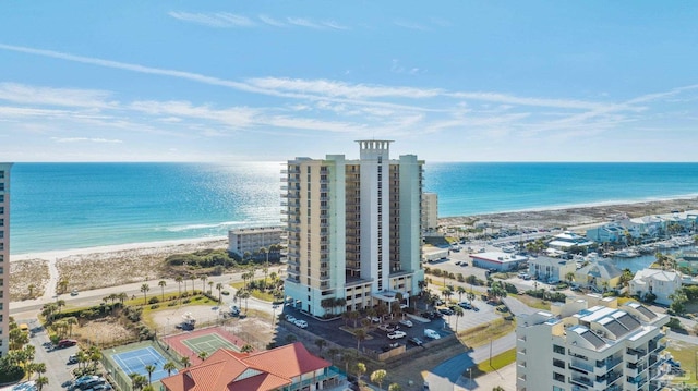 bird's eye view featuring a view of the beach and a water view