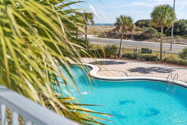 850 Ft Pickens Rd Unit 540, Pensacola Beach, FL 32561 - pool with fence and a patio