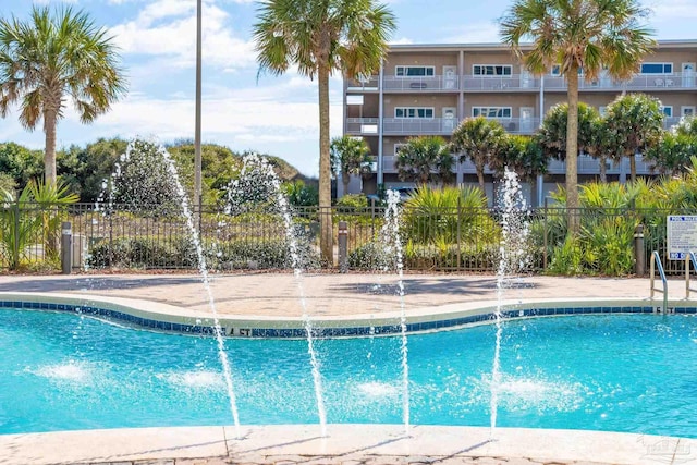 view of pool with pool water feature