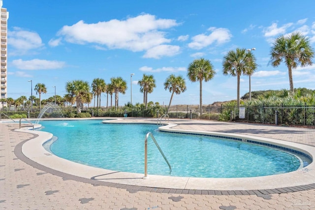 view of pool with pool water feature