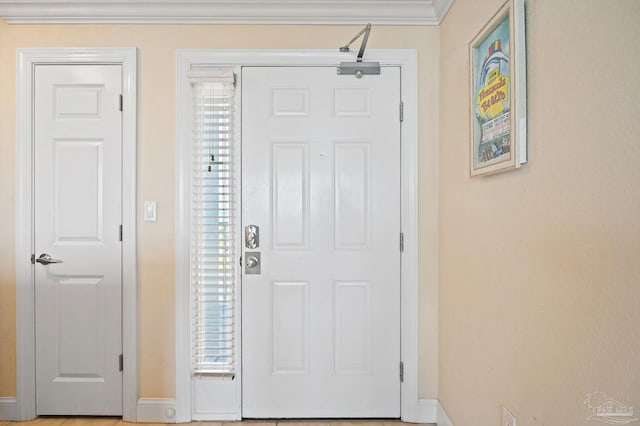 entrance foyer with a wealth of natural light and ornamental molding