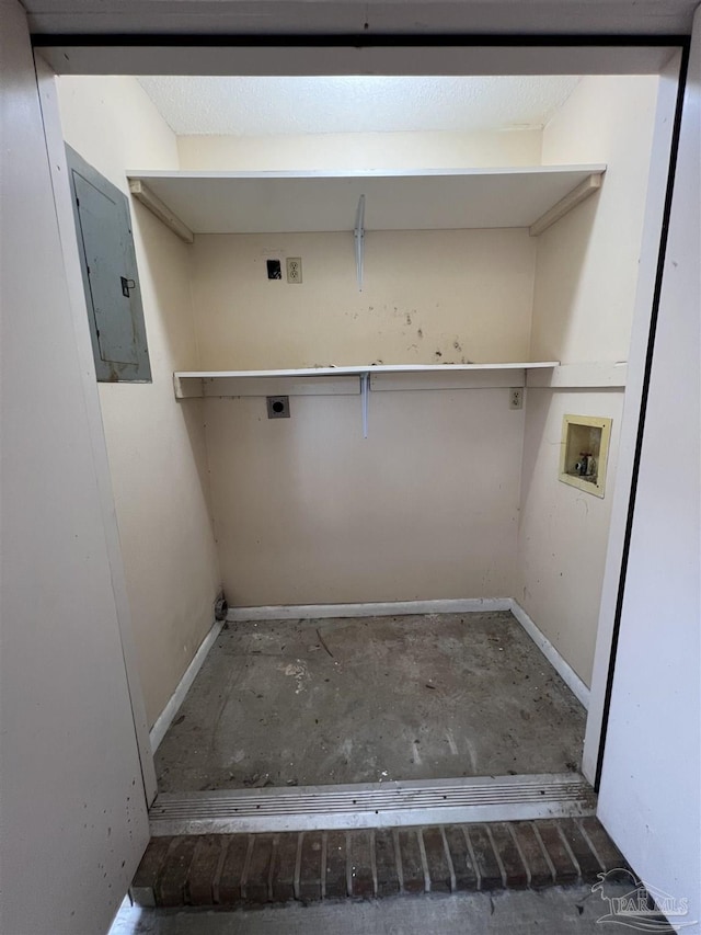 washroom with hookup for a washing machine, electric panel, baseboards, and electric dryer hookup