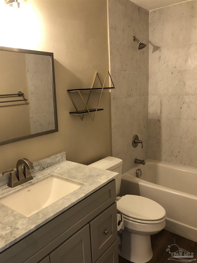 full bath with shower / washtub combination, vanity, and toilet