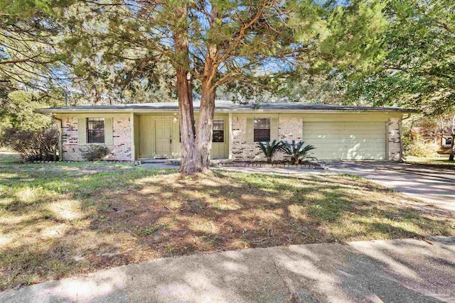 single story home with a garage