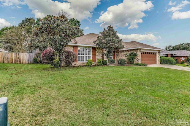 ranch-style house featuring a garage and a front lawn