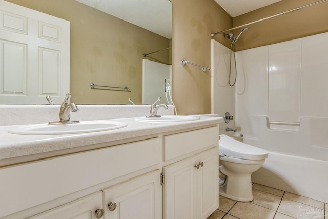 full bathroom featuring tile patterned flooring, vanity, washtub / shower combination, and toilet