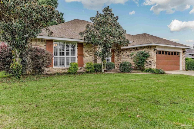 ranch-style home featuring a front lawn and a garage