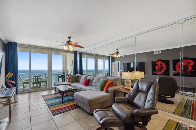 living room with visible vents, floor to ceiling windows, and ceiling fan