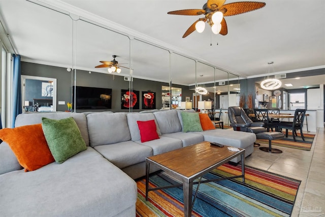 tiled living area with crown molding, visible vents, and ceiling fan