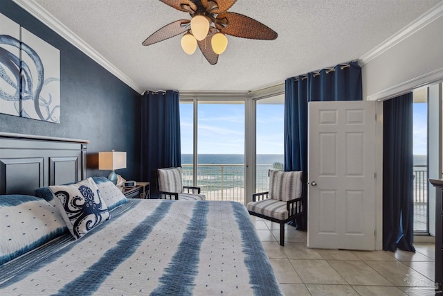 bedroom with crown molding, access to outside, light tile patterned floors, and a water view