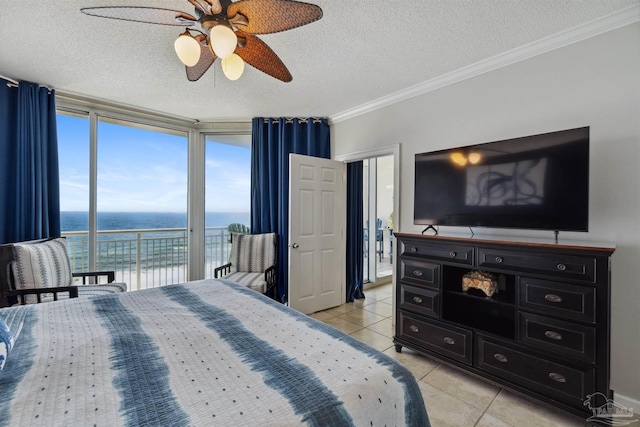 bedroom featuring ornamental molding, access to exterior, a textured ceiling, light tile patterned flooring, and ceiling fan