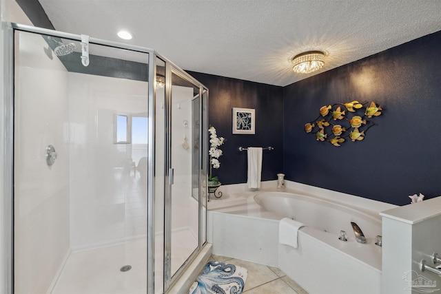 full bathroom with tile patterned floors, a garden tub, a stall shower, and a textured ceiling