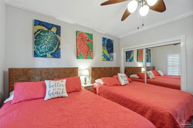 bedroom featuring a closet, a ceiling fan, and crown molding