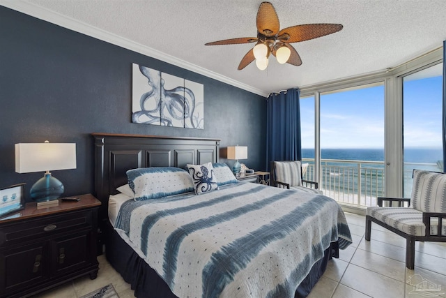 bedroom featuring crown molding, floor to ceiling windows, a water view, and a textured ceiling