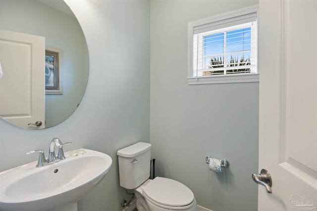 bathroom with toilet and sink