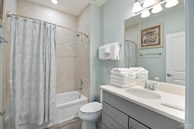 full bathroom featuring shower / tub combo, vanity, hardwood / wood-style flooring, and toilet