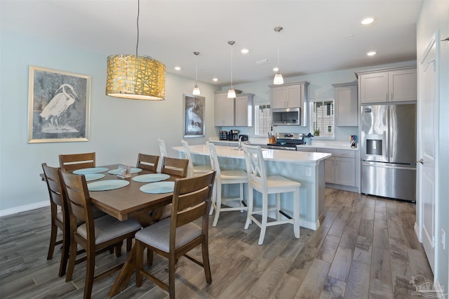 dining area with dark hardwood / wood-style floors