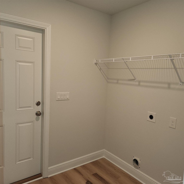 laundry room featuring hookup for an electric dryer and hardwood / wood-style flooring