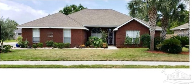 ranch-style home with a front lawn