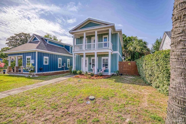 1621 E Cervantes St, Pensacola, FL 32501 - greek revival inspired property with board and batten siding, a balcony, a porch, and a shingled roof