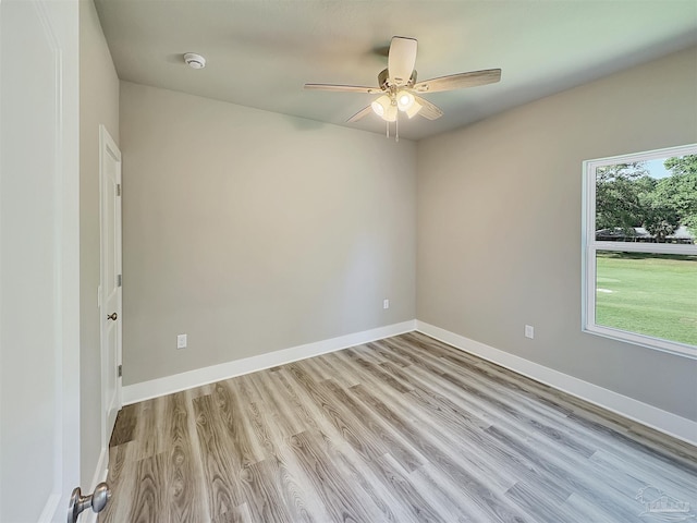 5773 Trevino Dr, Milton, FL 32570 - empty room with ceiling fan, a smoke detector, light wood-type flooring, and baseboards
