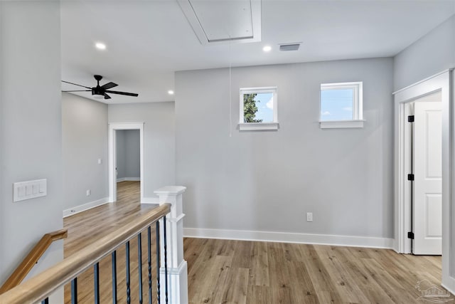 9616 Indian Stone Ct Lot 8, Navarre, FL 32566 - hall featuring attic access, visible vents, recessed lighting, light wood-style floors, and an upstairs landing