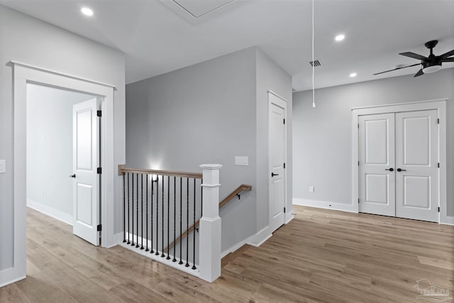 9616 Indian Stone Ct Lot 8, Navarre, FL 32566 - hall with attic access, baseboards, recessed lighting, an upstairs landing, and wood finished floors
