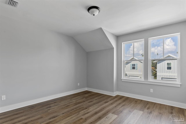 9616 Indian Stone Ct Lot 8, Navarre, FL 32566 - additional living space with wood finished floors, visible vents, and baseboards