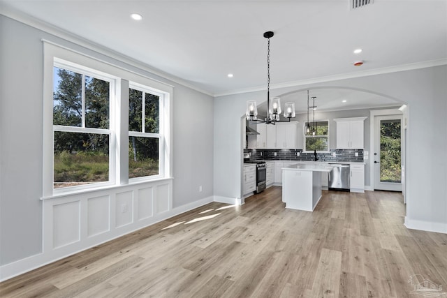9616 Indian Stone Ct Lot 8, Navarre, FL 32566 - kitchen featuring white cabinets, a center island, tasteful backsplash, a chandelier, and appliances with stainless steel finishes