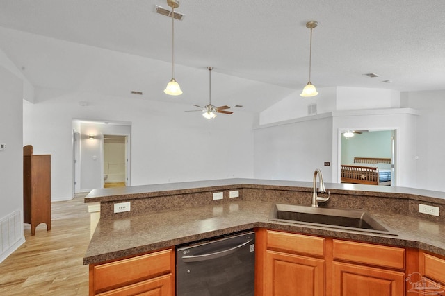 kitchen with pendant lighting, light hardwood / wood-style flooring, sink, dishwasher, and lofted ceiling