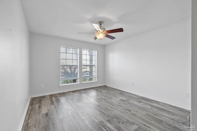 unfurnished room with hardwood / wood-style flooring, a textured ceiling, and ceiling fan