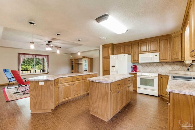 8206 Chumuckla Hwy, Pace, FL 32571 - kitchen with white appliances, a sink, a kitchen island, wood finished floors, and a textured ceiling