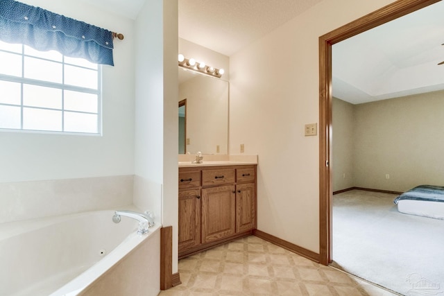 8206 Chumuckla Hwy, Pace, FL 32571 - full bath with a tub with jets, vanity, baseboards, and tile patterned floors