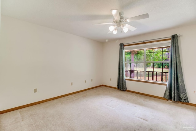 8206 Chumuckla Hwy, Pace, FL 32571 - unfurnished room with light carpet, ceiling fan, and baseboards
