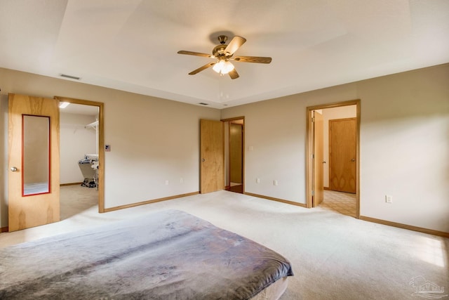 8206 Chumuckla Hwy, Pace, FL 32571 - bedroom featuring carpet floors, baseboards, a walk in closet, and a ceiling fan