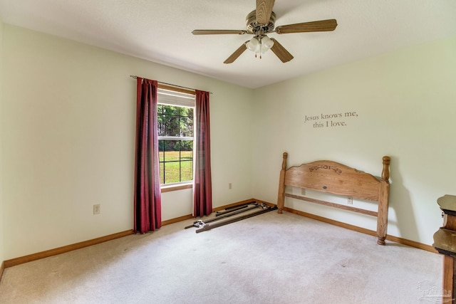8206 Chumuckla Hwy, Pace, FL 32571 - unfurnished bedroom with carpet flooring, baseboards, and a ceiling fan