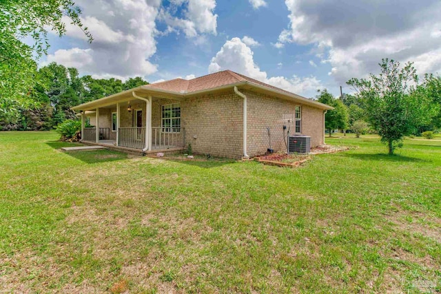 8206 Chumuckla Hwy, Pace, FL 32571 - rear view of property featuring cooling unit, a yard, brick siding, and a porch