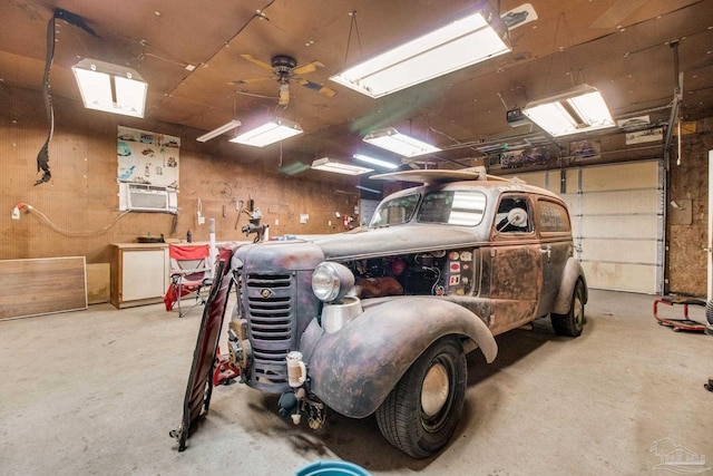 8206 Chumuckla Hwy, Pace, FL 32571 - garage with a workshop area, cooling unit, and a ceiling fan