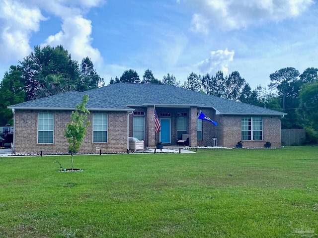 5773 Michael Dr, Milton, FL 32583 - ranch-style house featuring a front lawn and brick siding