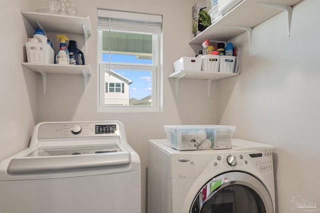 laundry room featuring washing machine and clothes dryer and laundry area