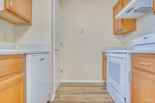 kitchen featuring light hardwood / wood-style floors, white appliances, and range hood