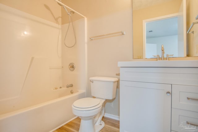 full bathroom with toilet, vanity, shower / bath combination, and hardwood / wood-style flooring