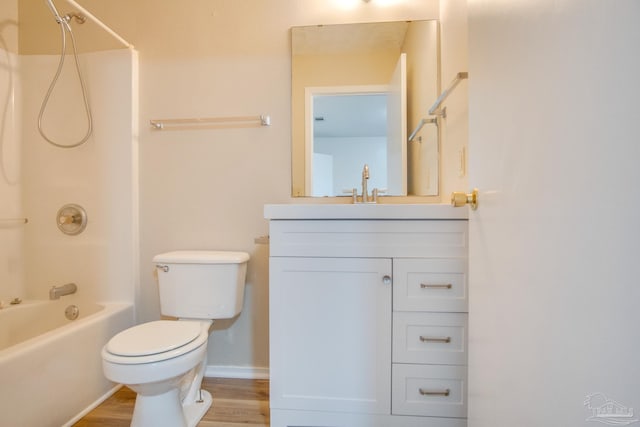 full bathroom with toilet, wood-type flooring, vanity, and bathing tub / shower combination