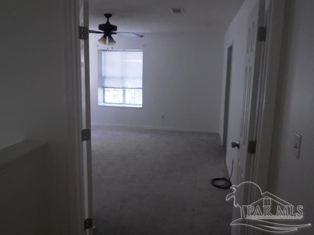 corridor featuring carpet flooring