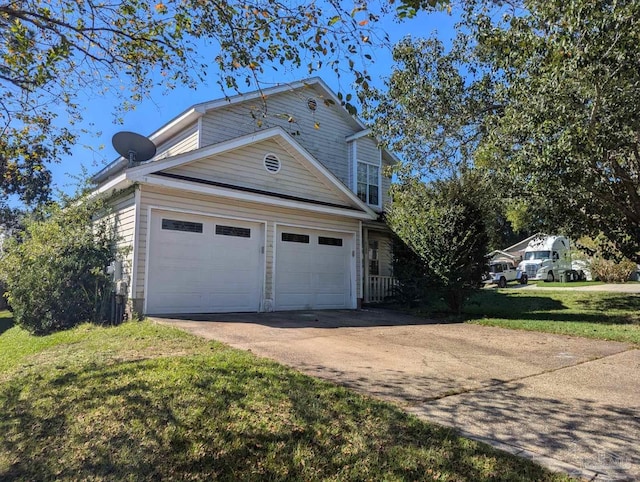 view of side of home featuring a garage and a lawn