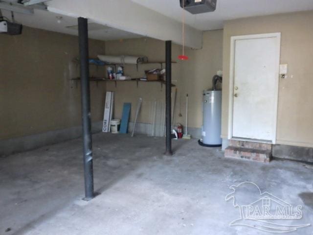 garage with a garage door opener and gas water heater